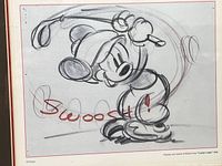 Close-up of pencil sketch showing Mickey Mouse swinging a golf club and red “Swoosh!” inscription