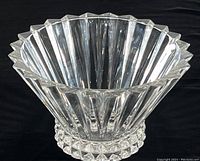 Full view of the clear fluted crystal bowl showing its shape, size, and base design.