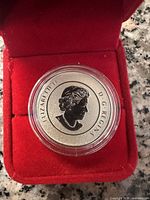 Obverse side of the silver coin showing Queen Elizabeth II profile with inscriptions.