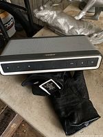 Photo of the Bose SoundLink Bluetooth Speaker III showing front control panel and grey grille.