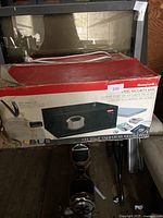 Honeywell steel security safe in its original box showing product image and branding.