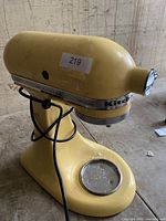 Yellow KitchenAid Artisan stand mixer with power cord, tested and working condition photo.