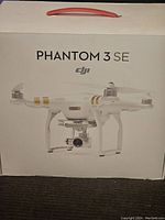 Front of sealed DJI Phantom 3 SE box showing product branding and image of drone