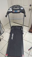 Front view of the Merax M71 treadmill showing walking belt, frame, and base with foldable design.