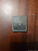 Front of the black Nintendo DS game cartridge showing wear and label remnants.