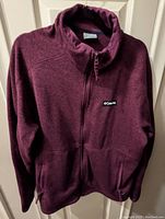 Front view of Columbia women's purple fleece jacket size 2X with zipper and side pockets.
