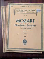 Front cover of Mozart Nineteen Sonatas for the Piano Book I from Schirmer's Library of Musical Classics with vintage beige design and title details.
