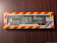 Front view of the new-in-box Lionel British Columbia Railway boxcar model in original packaging.