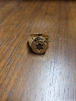 Front-facing view of ring bezel showing Maple Leafs logo and surrounding inscription