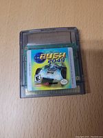Front view of Rush 2049 Game Boy Color cartridge showing game label and title