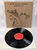 Vinyl platen and red center label of Bob Dylan "Slow Train Coming" LP showing the record itself