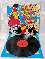 Front view of Elvis Costello Armed Forces vinyl LP record on original album cover showing colorful abstract art and album title.
