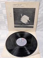 Photo of vinyl record disc with original album label visible on a white inner sleeve, showing clean condition and original pressing details.