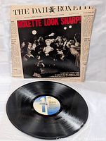 Vinyl record disc and cover showing label and condition of record surface and cover.