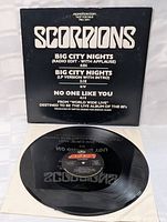 Front of vinyl record showing label and part of the vinyl surface.