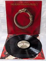 Vinyl record LP from The Alan Parsons Project Vulture Culture with cover, inner sleeve, and record disc visible on a white background.