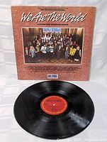 Front of the vinyl record showing the red and black USA For Africa label