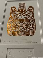 Full front view of framed foil print showing copper embossed formline Beaver design, matte, and Bill Reid signature