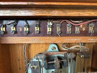 Top view of electrical connection terminals labeled with timing and functional labels inside the synchronizer unit.