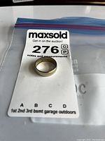 Top-down view of the ring on MaxSold card showing exterior and overall condition.