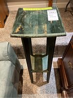 Top view of the wooden plant stand showing the 9.5" x 9.5" dimensions and worn green finish surface.