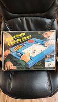 Photo of the original box of 1978 Rocket Hockey game showing colorful vintage graphics and bilingual text