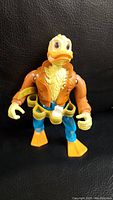 Front view of 1989 Ninja Turtles Ace Duck figure showing head, jacket, and legs.