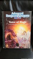 Front cover of Advanced Dungeons & Dragons Tome of Magic rulebook, showing artwork and title