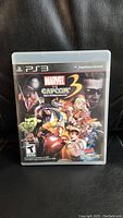 Front cover photo of the PS3 game Marvel vs Capcom 3 showing main artwork and ESRB rating.