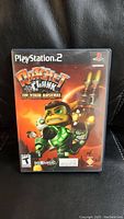Front cover of Ratchet & Clank PS2 game case showing main characters and title.