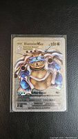 Front of Pokemon Blastoise VMax fan art card showing holographic artwork and card text details.
