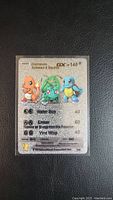 Full face of fan art Pokemon card showing Charmander, Bulbasaur, and Squirtle with moves and HP 140