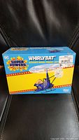 Front view of sealed Whirlybat toy box showing Batman Whirlybat Aerial Pursuit Copter graphics and branding.
