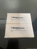 White non-retail packaging boxes with barcode labels for Samsung Note 4 OEM batteries.