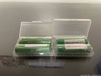 Four Panasonic 18650 rechargeable batteries packaged in two transparent plastic boxes, two batteries in each box, showing labels confirming 2500mAh and 3.7V specifications.