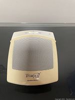 Front view of off-white TrueAir Hamilton Beach air cleaner showing perforated grille and branding.