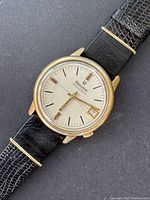 Front view close-up showing silver dial, Bulova Accutron logo, hour markers and date window.