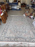 Full view of laid-out rug showing overall pattern and condition