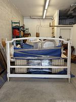 Front view of the wooden headboard showing full frame and decorative finials.