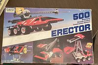 Box front displaying the 500 motorized remote control construction system with example model images and branding.