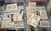 Photo showing an assortment of vintage wooden block rubber stamps including teddy bears, sentimental phrases, and floral borders.