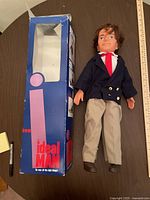 Photo showing vintage Ideal Man doll next to box, approximately 21 inches tall.