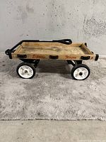 Side view of the wooden utility wagon with metal frame and white wheels labeled 'Express Wagon'