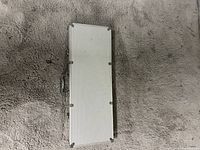 Closed rectangular silver metal case for poker chips