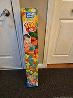 Photo of the Mega Bloks 100 piece set box standing upright showing colorful packaging with toddler image and Mega Bloks logo.