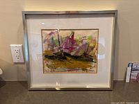 Photo showing the full framed oil painting depicting sailboats with expressive, colorful brush strokes in a brass frame.