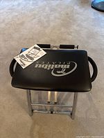 Top view of the Malibu Pilates chair seat with visible logo and manual.