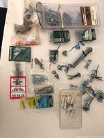 All packets and loose screws laid out