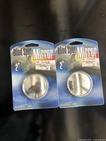 Front of two sealed packages showing product and branding