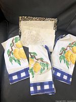 Lemon motif napkins, solid white napkins visible